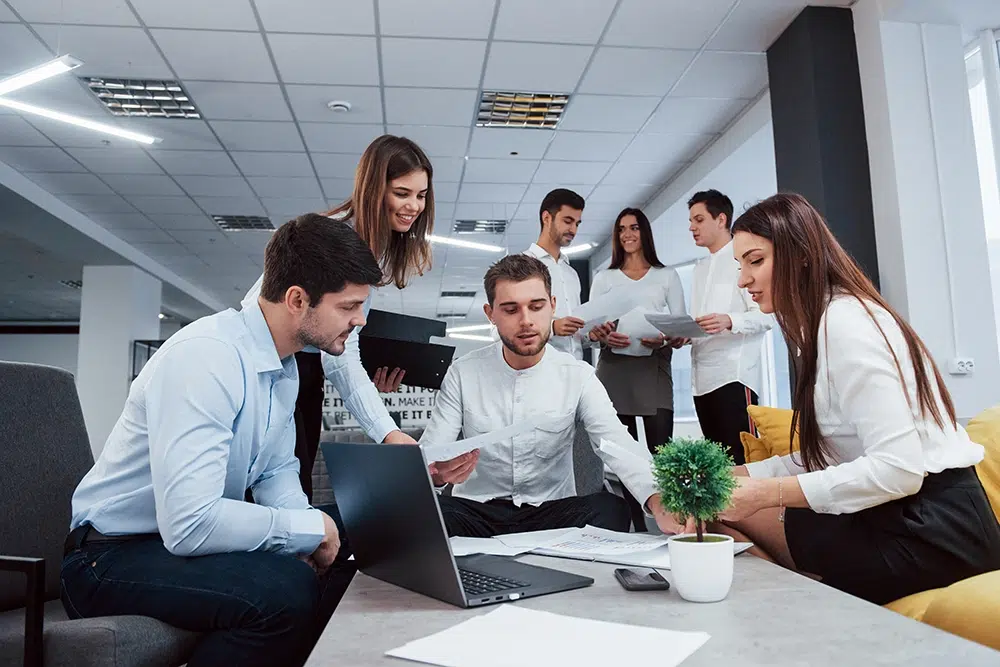 making-business-plan-group-young-freelancers-office-have-conversation-smiling